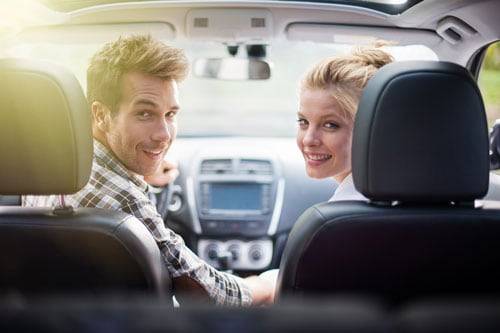 A couple driving a car