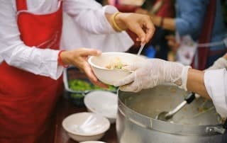 Volunteer working at a soup kitchen