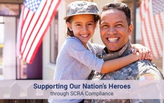 A happy US army officer holding her daughter up on a bright sunny day with a background of US Flags
